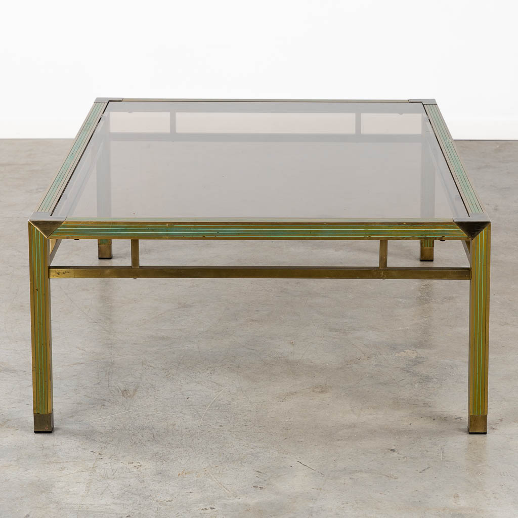 A mid-century coffee table, brass and glass in the style of Belgo Chrome. (L:88 x W:128 x H:43 cm)