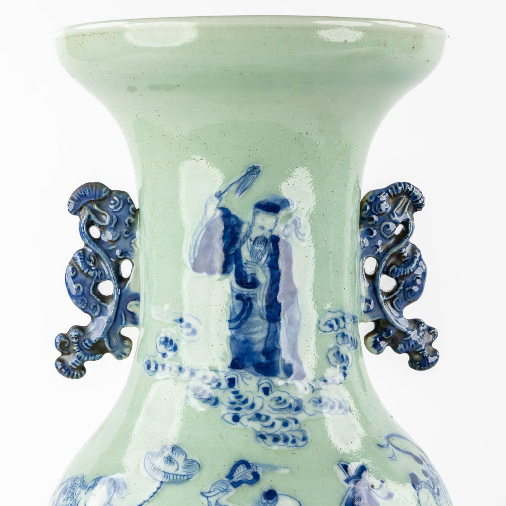 A Chinese vase blue-white decor of the Eight Immortals, added a pair of Nanking vases. (H:61 x D:23 cm)