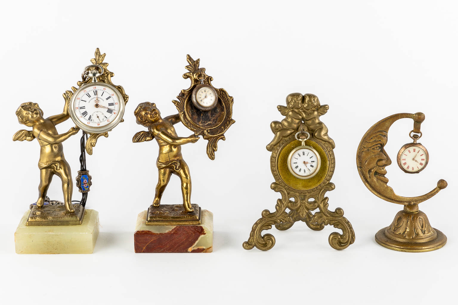 Four decorative pocket watch holders, with 4 pocket watches. Roskopf and others.