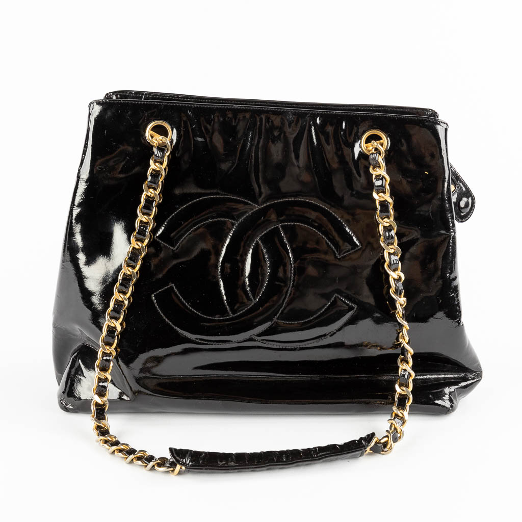 Chanel 'Black Patent CC Shoulder Bag' a purse made of leather with gold ...