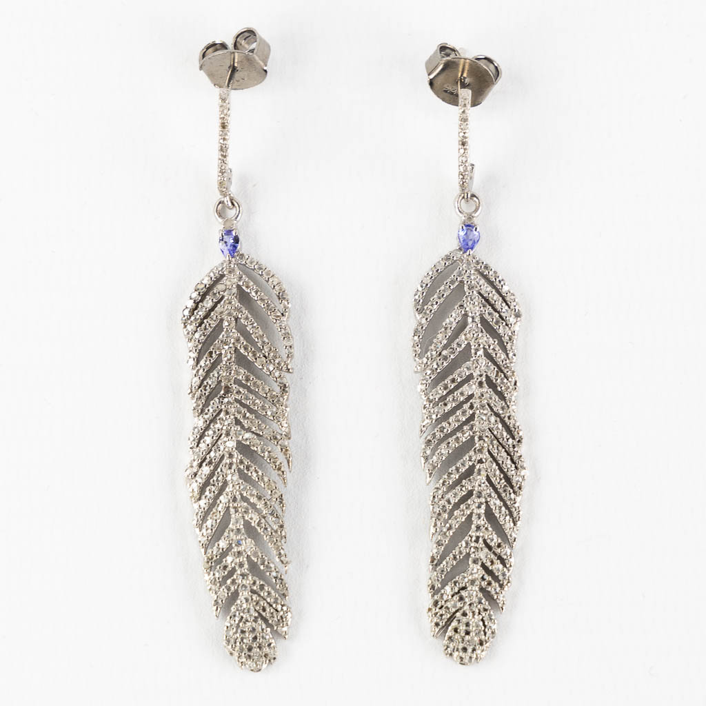 A pair of feather shaped earrings, silver with old-cut diamonds and Tanzanite cabochons. (H:7,5 cm)