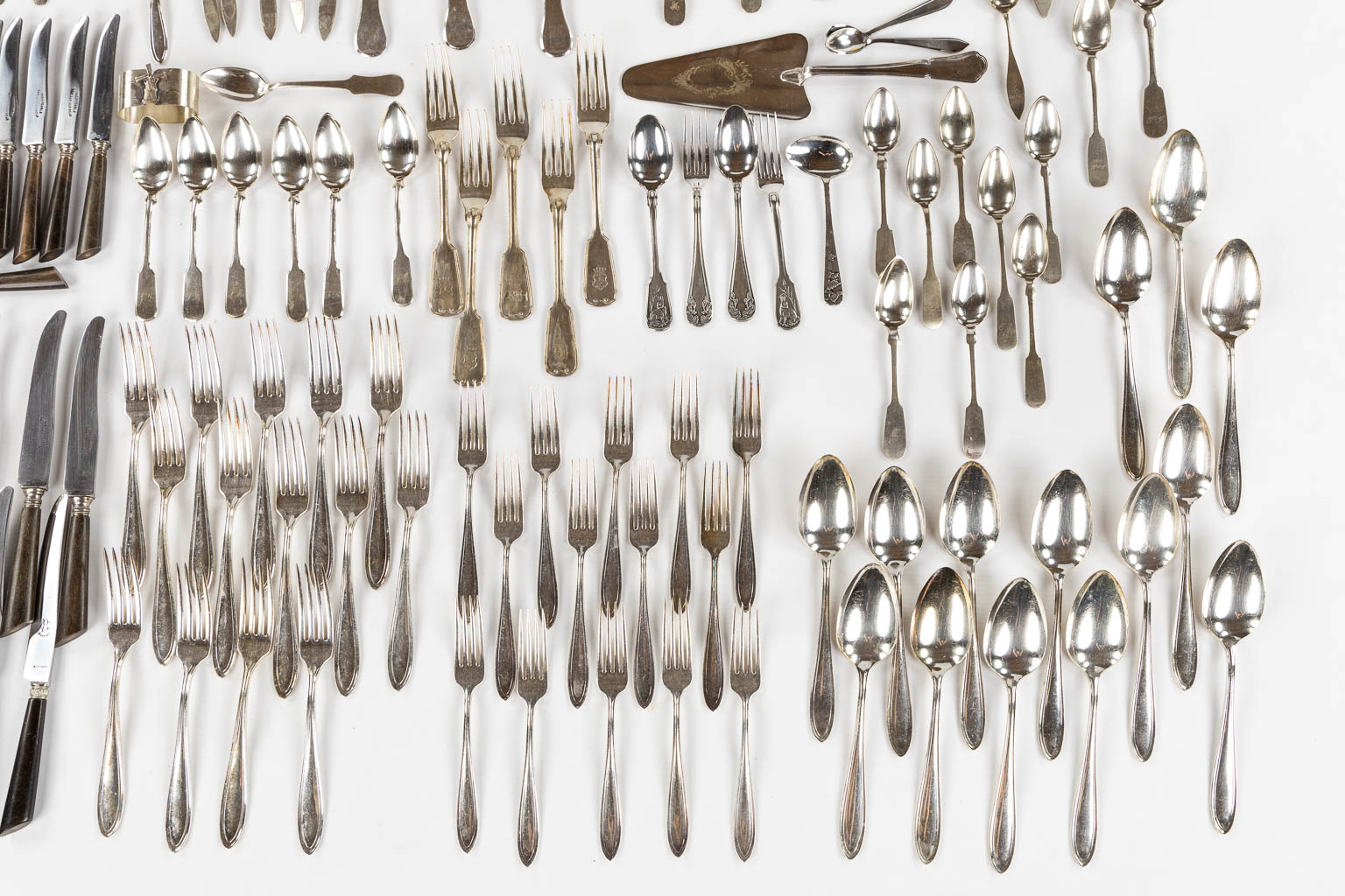 A large collection of silver and silver-plated cutlery. 