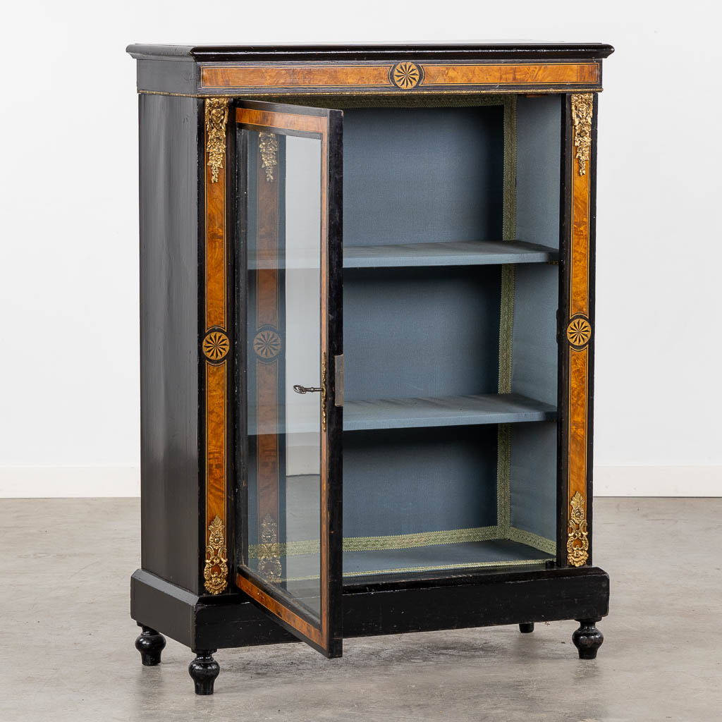 A small display cabinet, marquetry inlay and mounted with bronze. Napoleon 3. (L:32 x W:76 x H:104 cm)