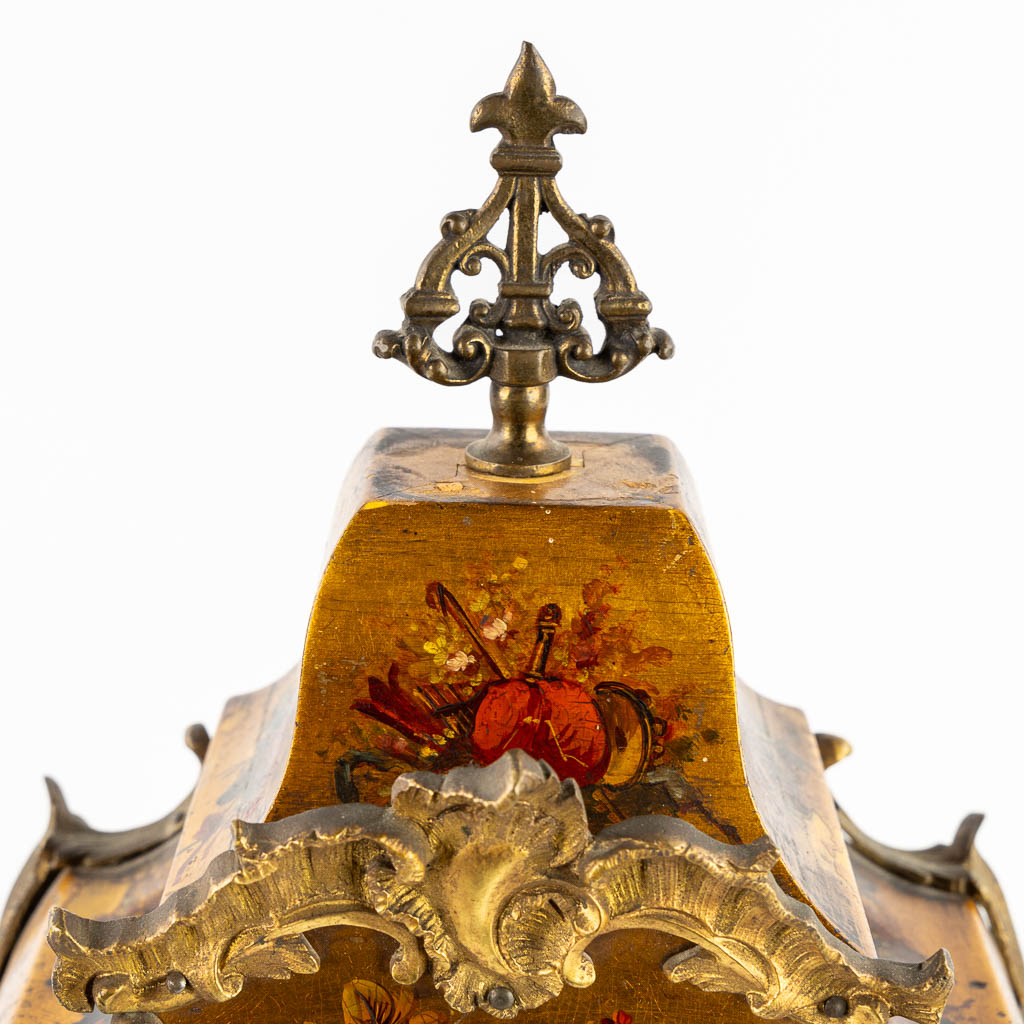 A cartel clock, hand-painted floral decor, mounted with bronze. (c.1900). 