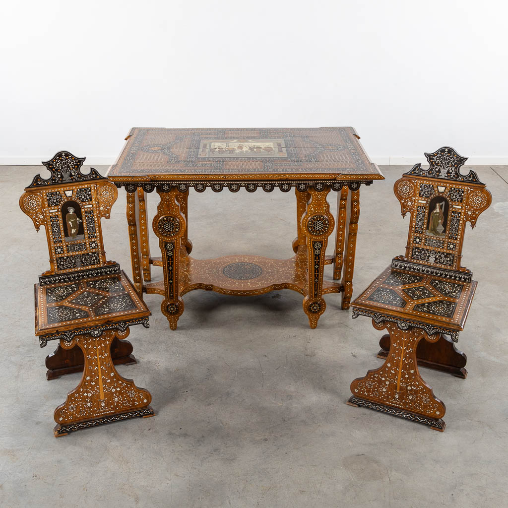 A Syrian table with two matching chairs, Marquetry and copper inlay, 19th C. (L:87 x W:121 x H:80 cm)