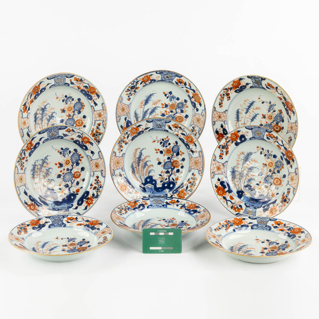 Nine Chinese Imari style plates with a floral decor. 18th C. (D:23 cm)