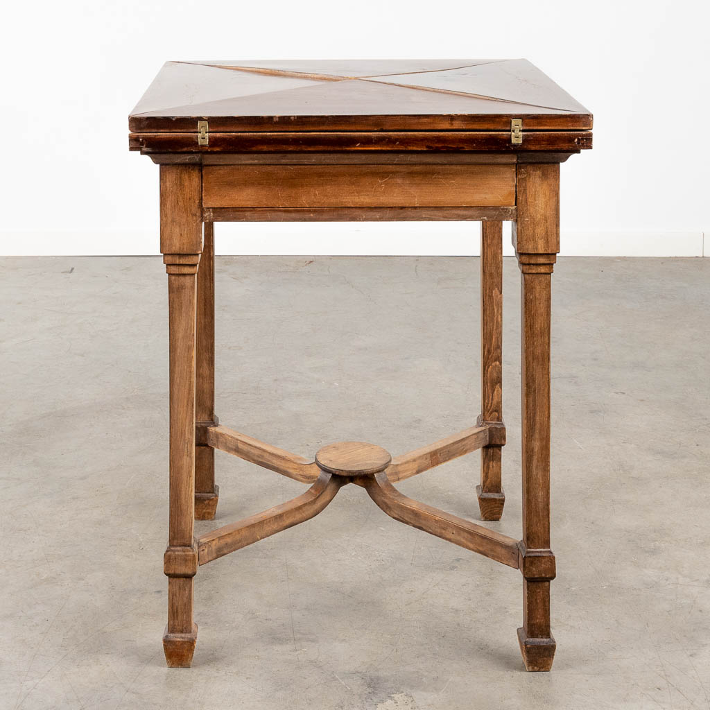 An antique game table with folding top. 19th C. (L:84 x W:84 x H:77 cm)