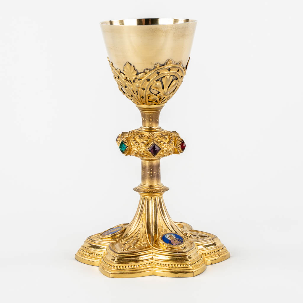 A Gothic Revival chalice with enamel plaques, cabochons. Silver Cuppa, Gilt brass, 19th C.