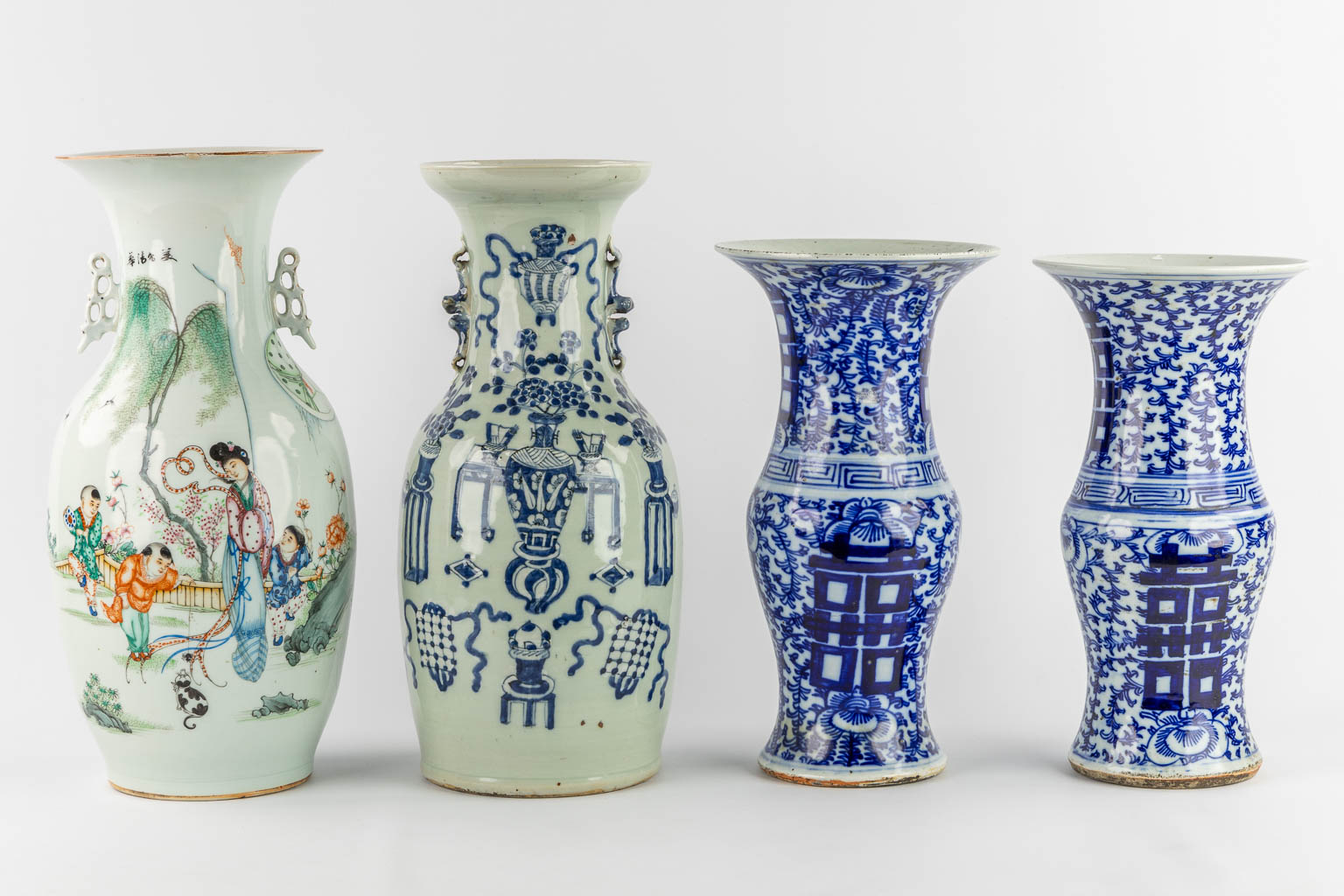 Four Chinese vases, blue white and polychrome. 