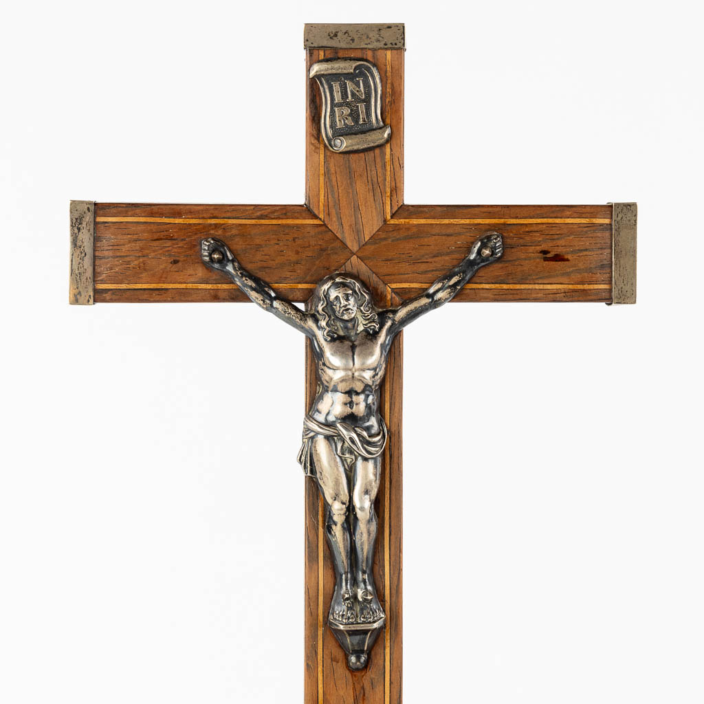 Two crucifixes with a silver Corpus Christi, 19th C. (W:24 x H:70 cm)