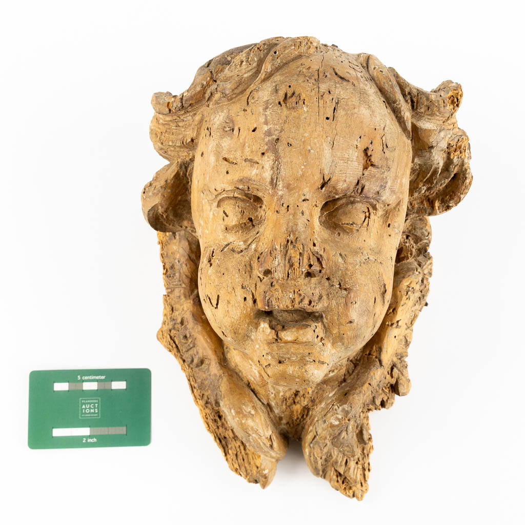 Head of an angel, an antique wood sculpture. 18th C. (L:18 x W:20 x H:30 cm)