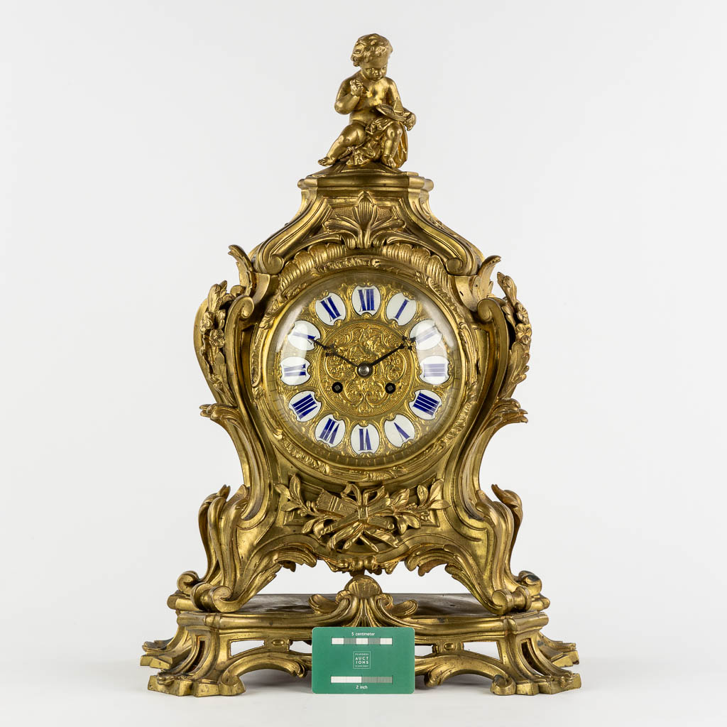 A large mantle clock, bronze, Louis XV style. 19th C. (L:22 x W:38 x H:56 cm)