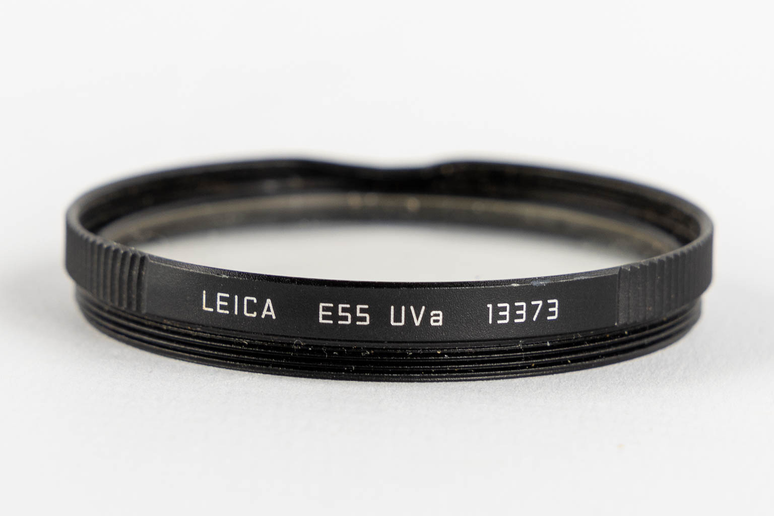 Leica, vier lenzen, en twee filters. (H:15,5 cm)