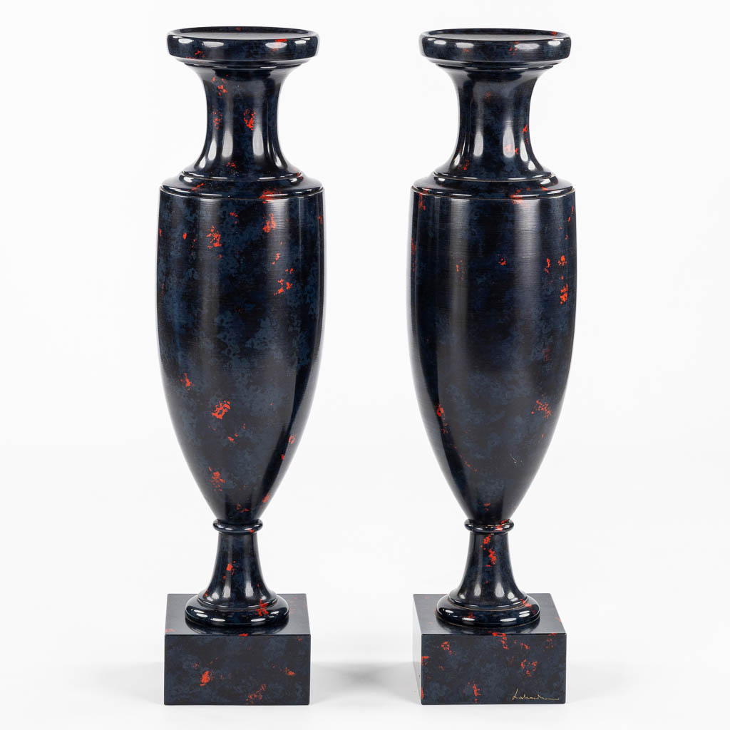 A pair of higly decorative and large urns, wood turned with a 'Faux Marble' decor.