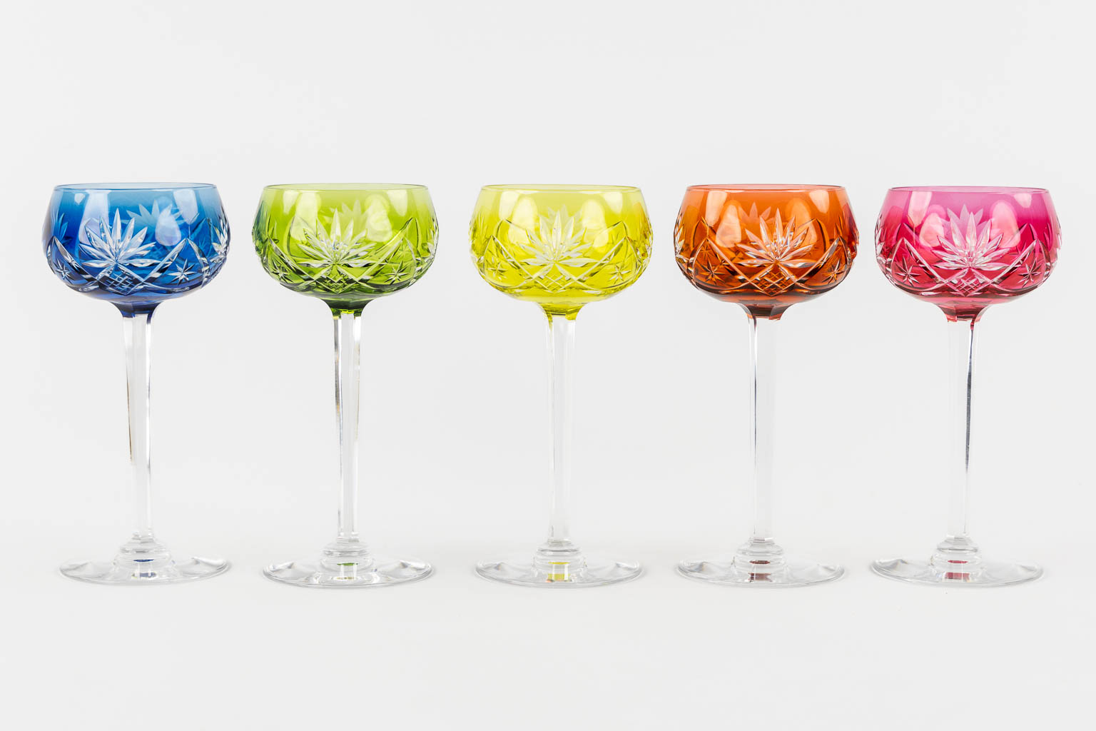 Val Saint Lambert, 36 coloured goblets and two carafes. 