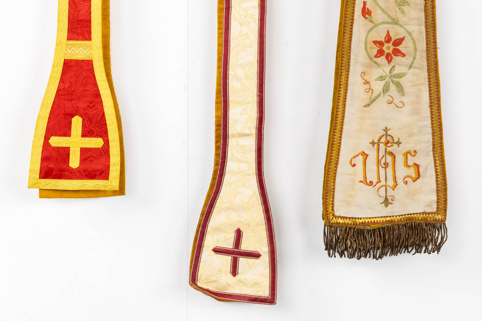 Two Dalmatics and a Roman Chasuble, added are a big collection of stola and maniple. 