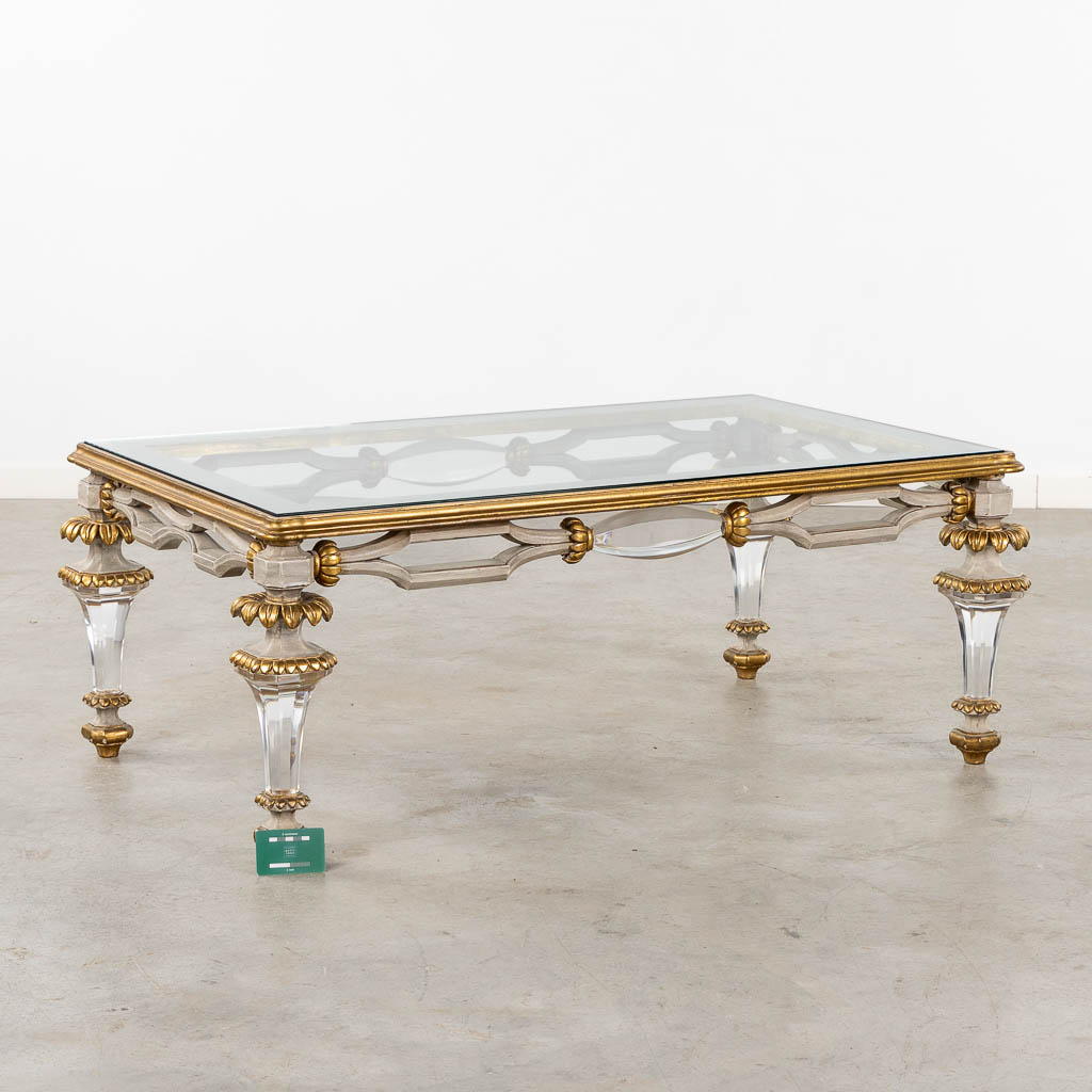 A Hollywood-Regency style coffee table, sculptured wood and plexiglass. (L:73 x W:120 x H:45 cm)