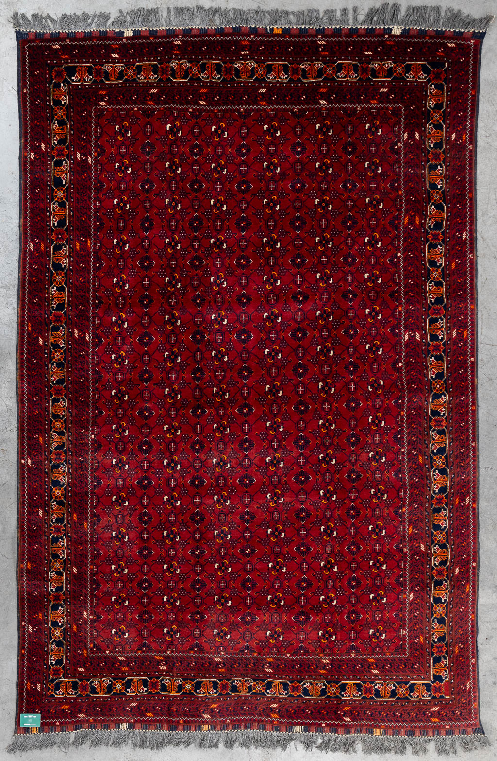 An Oriental hand-made carpet, Afghan. (L:290 x W:193 cm)