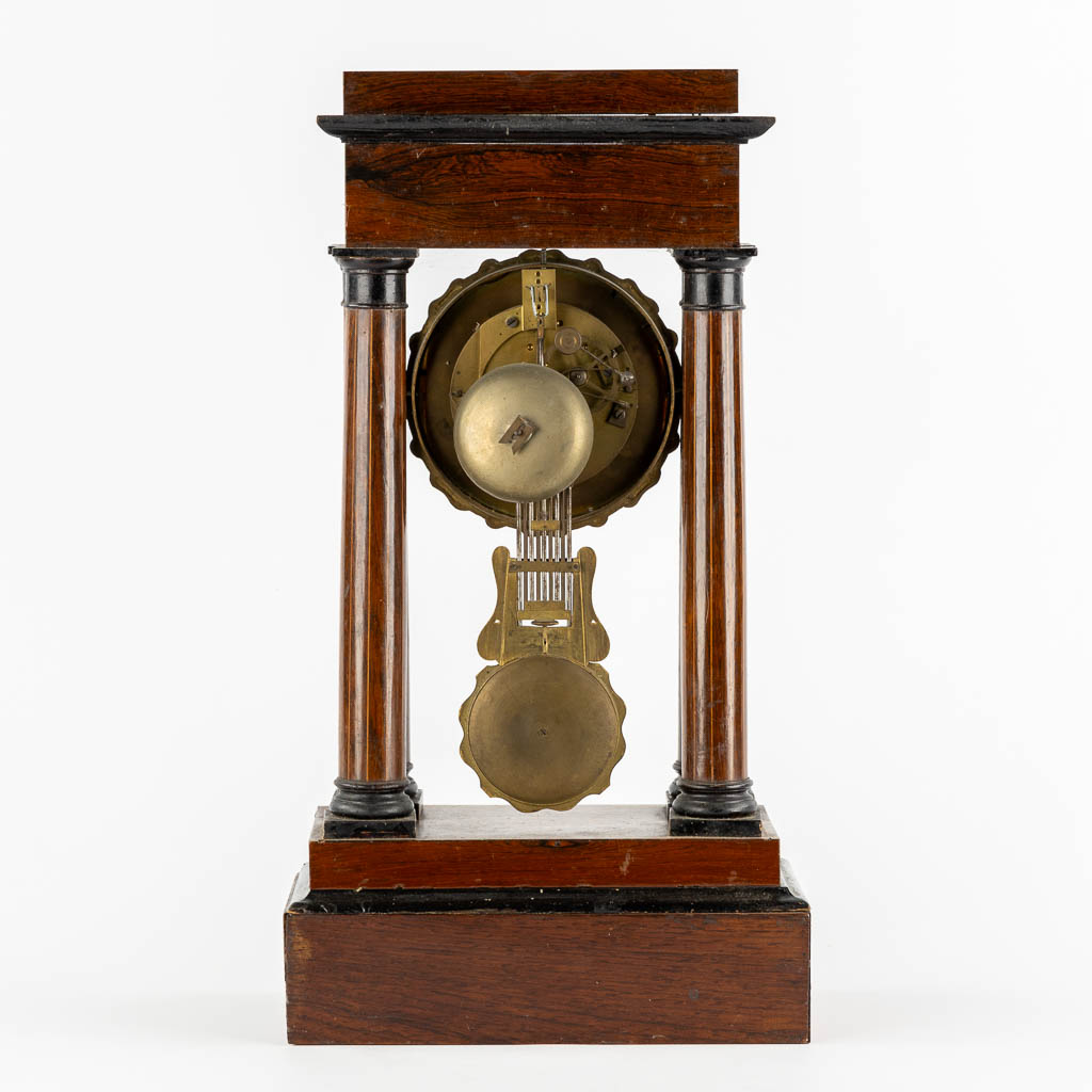 A column clock, marquetry inlay and gilt bronze. 19th C. (L:15 x W:25 x H:46 cm)