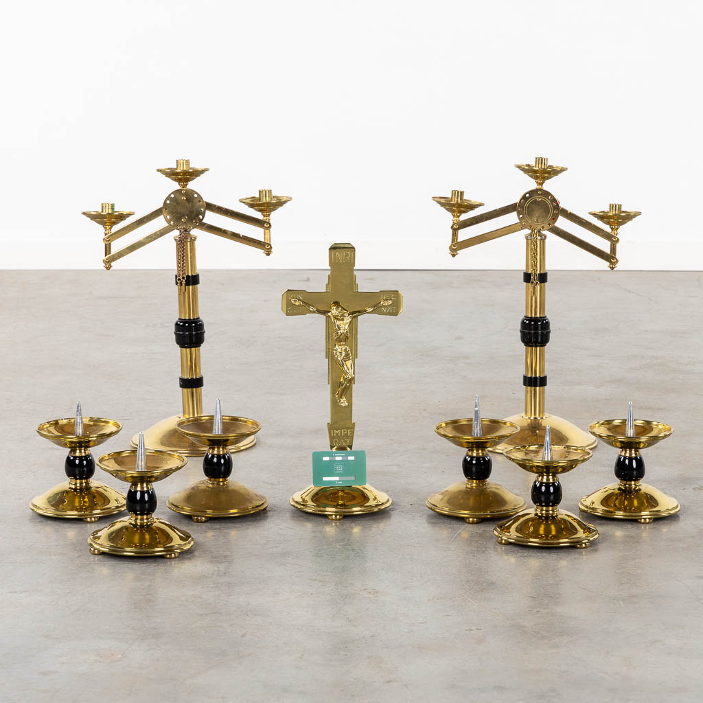 An altar crucifix with 6 candelabra, added are two large with moveable arms. (W:37 x H:51 cm)