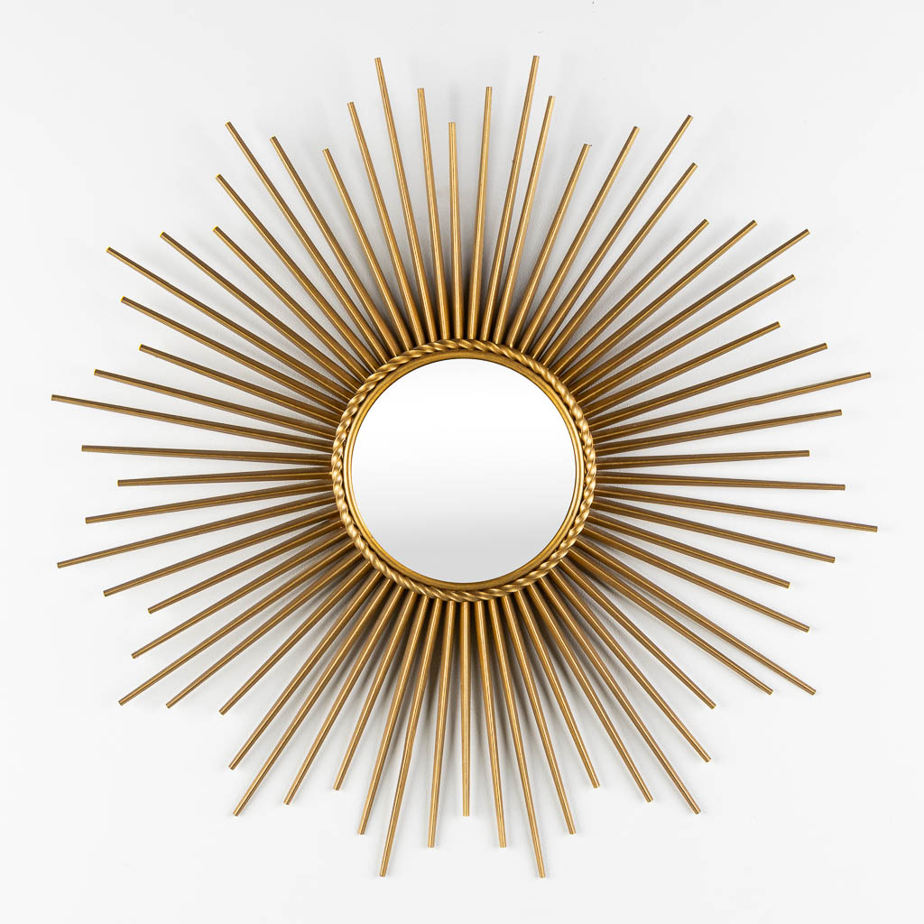 Chaty Vallauris, a sunburst mirror. Gilt metal. (D:70 cm)