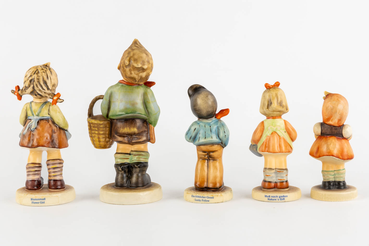 Hummel, 14 figurines, some with original boxes. (H:19 cm)