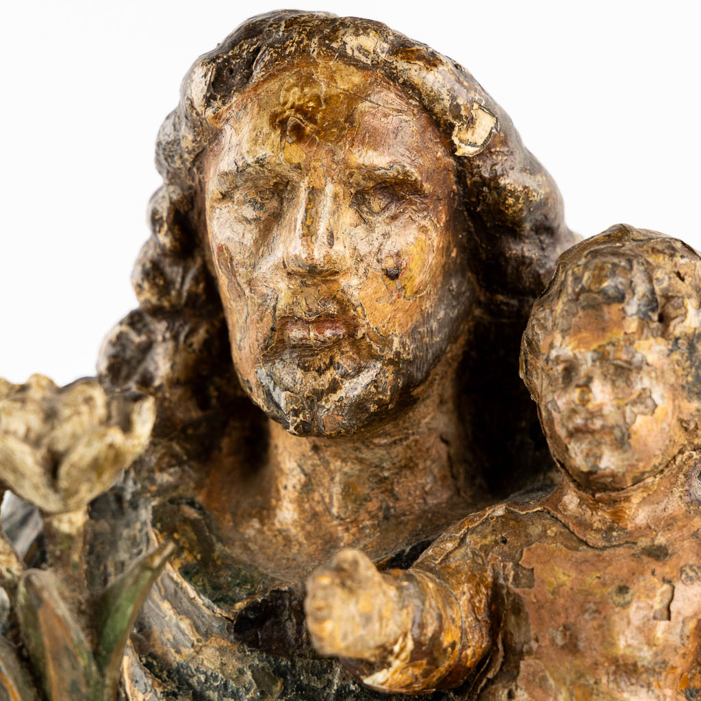 An antique wood-sculptured figurine of Saint Joseph with a Child, Flanders, 17de/18de eeuw. 