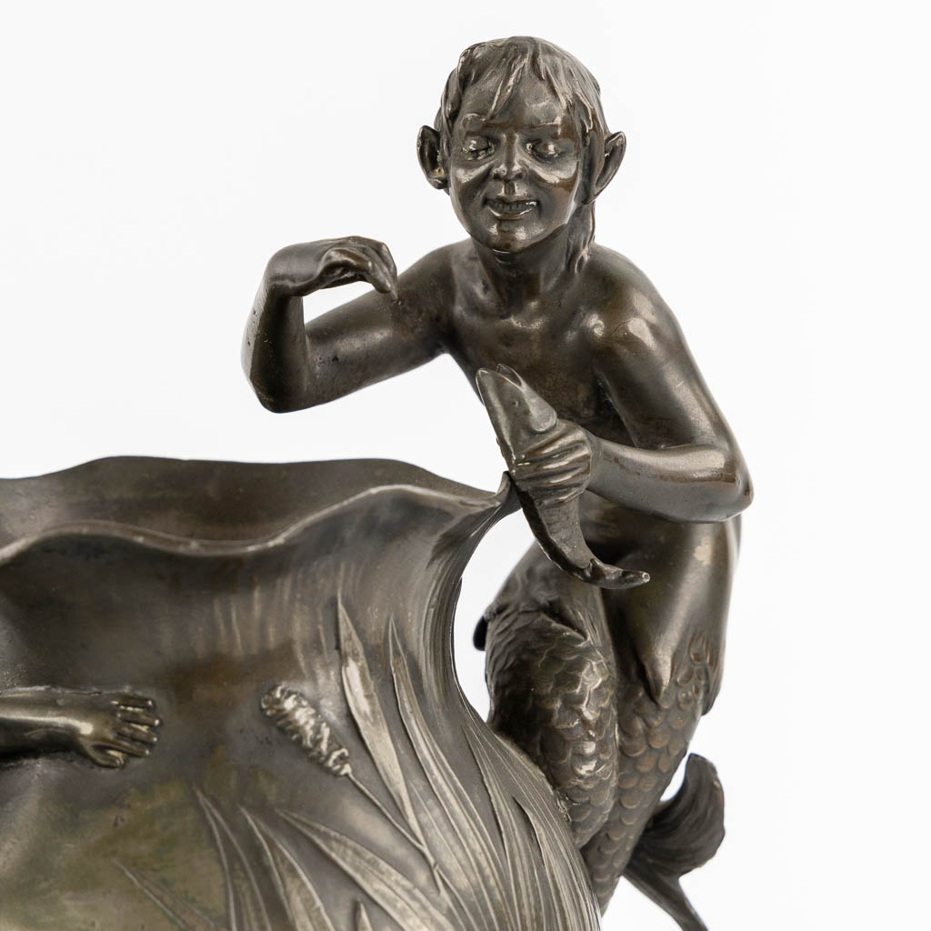 WMF, a pair of vases with playing children, a Mermaid and a Satyr, Art Nouveau, circa 1900. (L:13 x W:17 x H:29,5 cm)