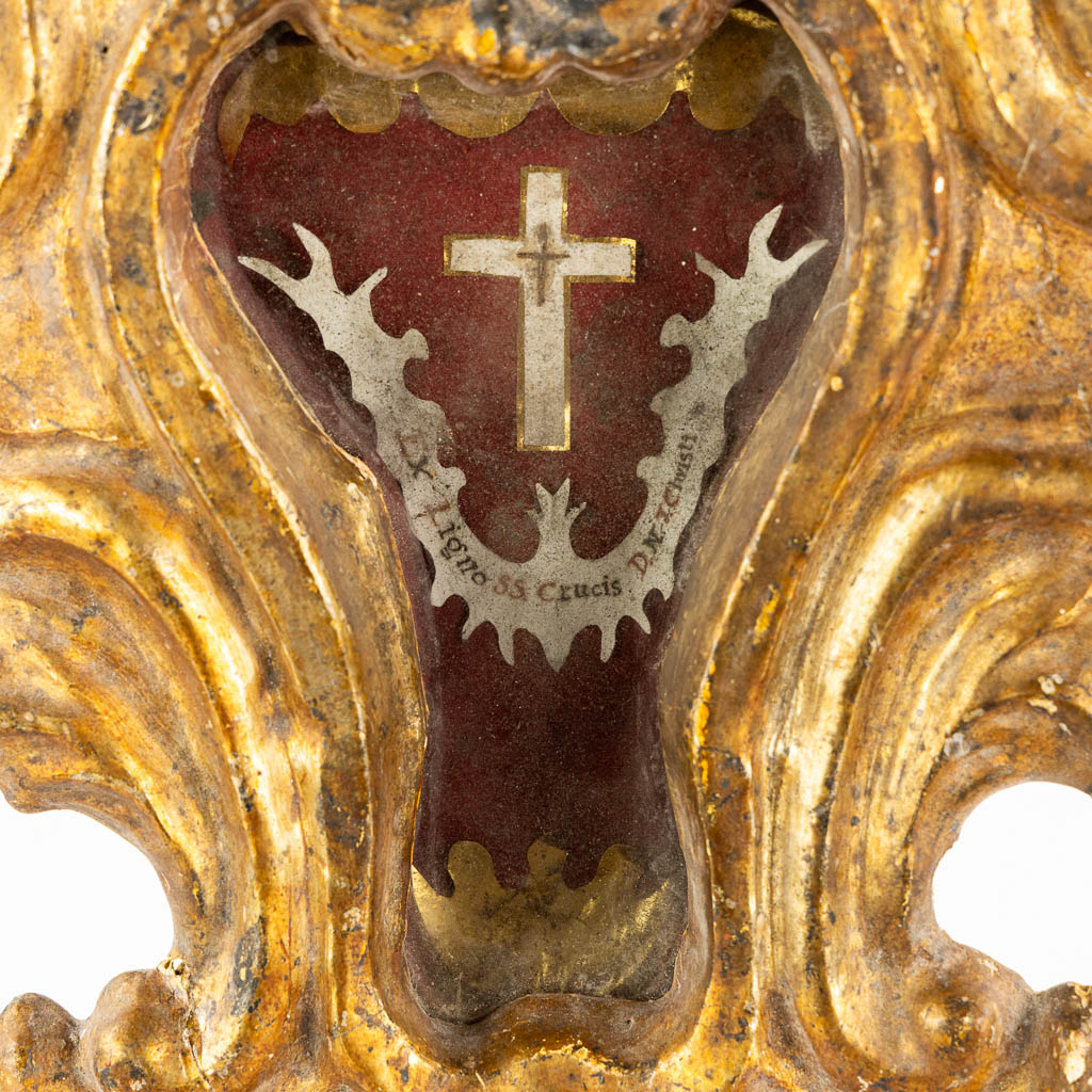 An antique wood-sculptured reliquary holder with a sealed relic of the true cross, Baroque, 18th C.