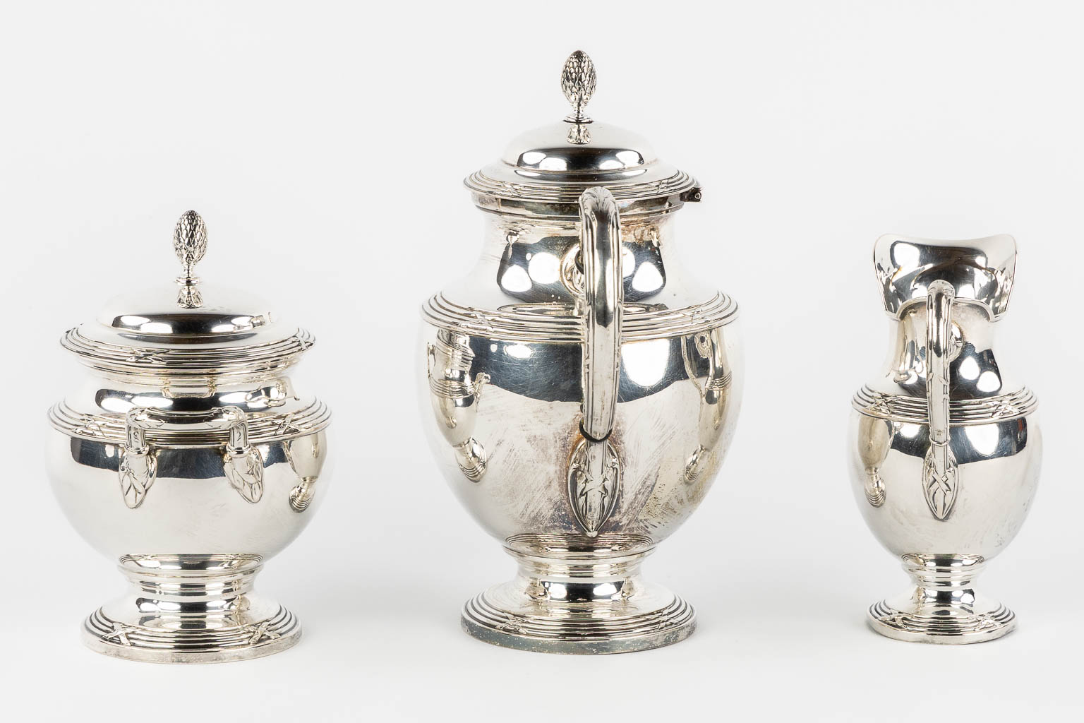 A three-piece silver coffee service, Louis XVI style, Germany, 800/1000. 1,115kg. 