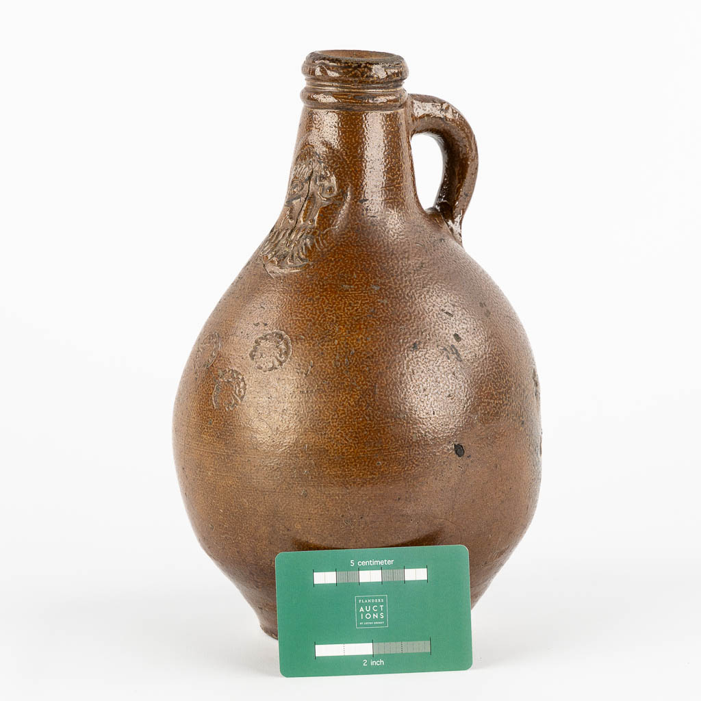 An antique Bartmann jug with three stamps, 17th C. (H:27 x D:17 cm)