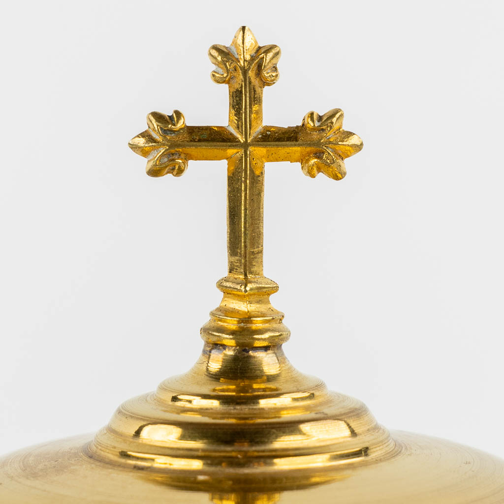 Two gold-plated Gothic Revival Ciboria and a modernist Chalice with paten. (H:30 x D:12 cm)