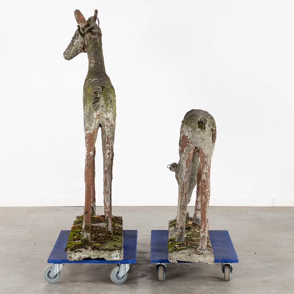 An exceptional and decorative pair of deer, concrete, circa 1920. (L:40 x W:130 x H:140 cm)