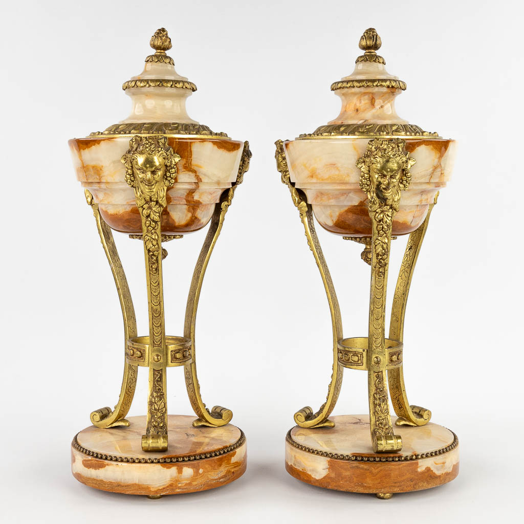 A pair of cassolettes, onyx mounted with bronze in Louis XVI style. Circa 1900. (H:45 x D:18 cm)