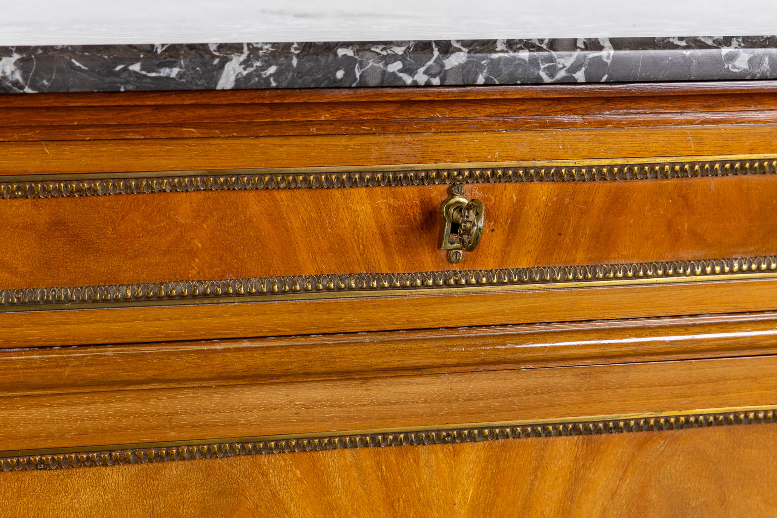 A console table with three drawers, marble top. Louis XVI style. (L:43 x W:154 x H:92 cm)