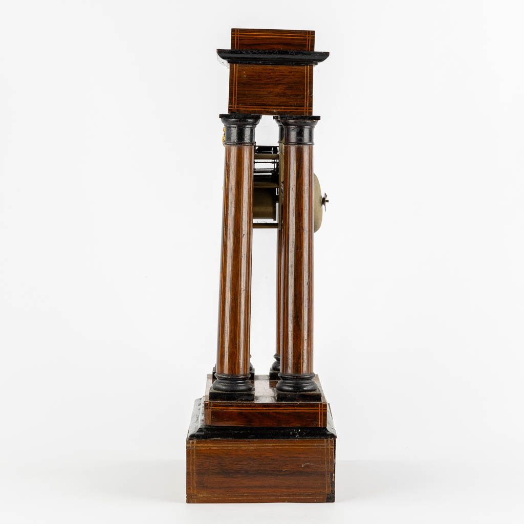 A column clock, marquetry inlay and gilt bronze. 19th C. (L:15 x W:25 x H:46 cm)