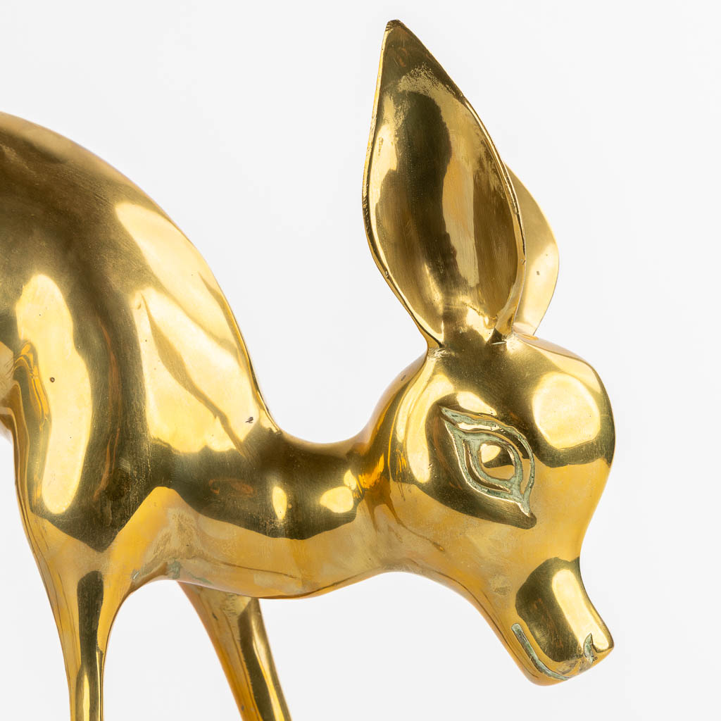 A pair of brass deer, Hollywood Regency style. (W:56 x H:33 cm)