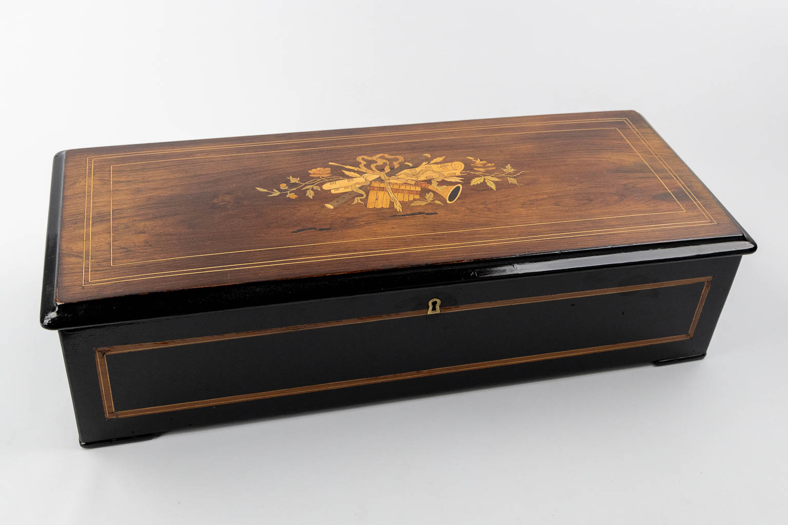 Nicole Frères, Genève and London, an antique music box in a marquetry inlay wood case. (L:30 x W:70 x H:18 cm)