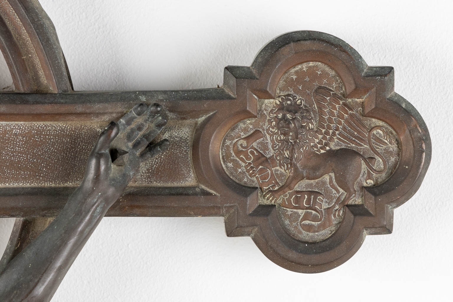 A large crucifix with images of The Four Evangelist, repousse copper on wood. (W:57 x H:90 cm)