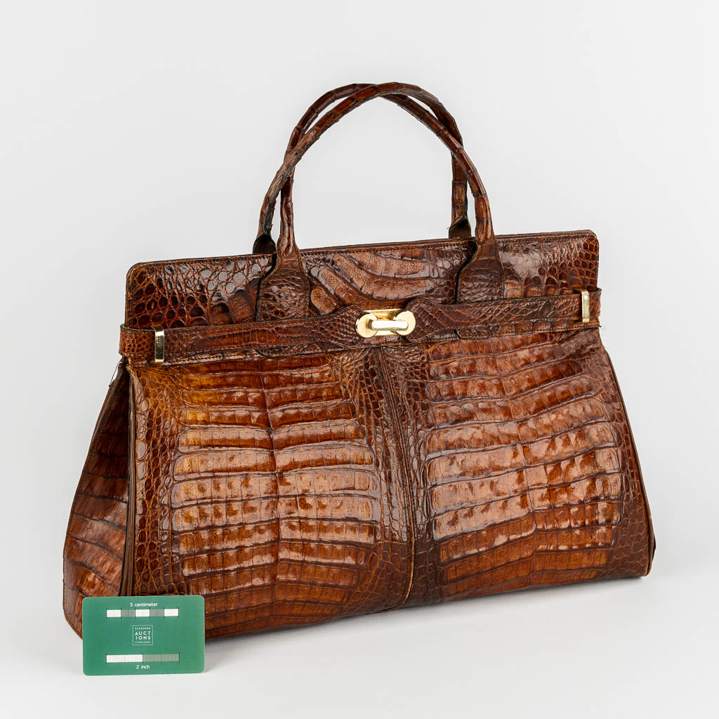 A vintage handbag, crocodile leather and gold-plated hardware. 