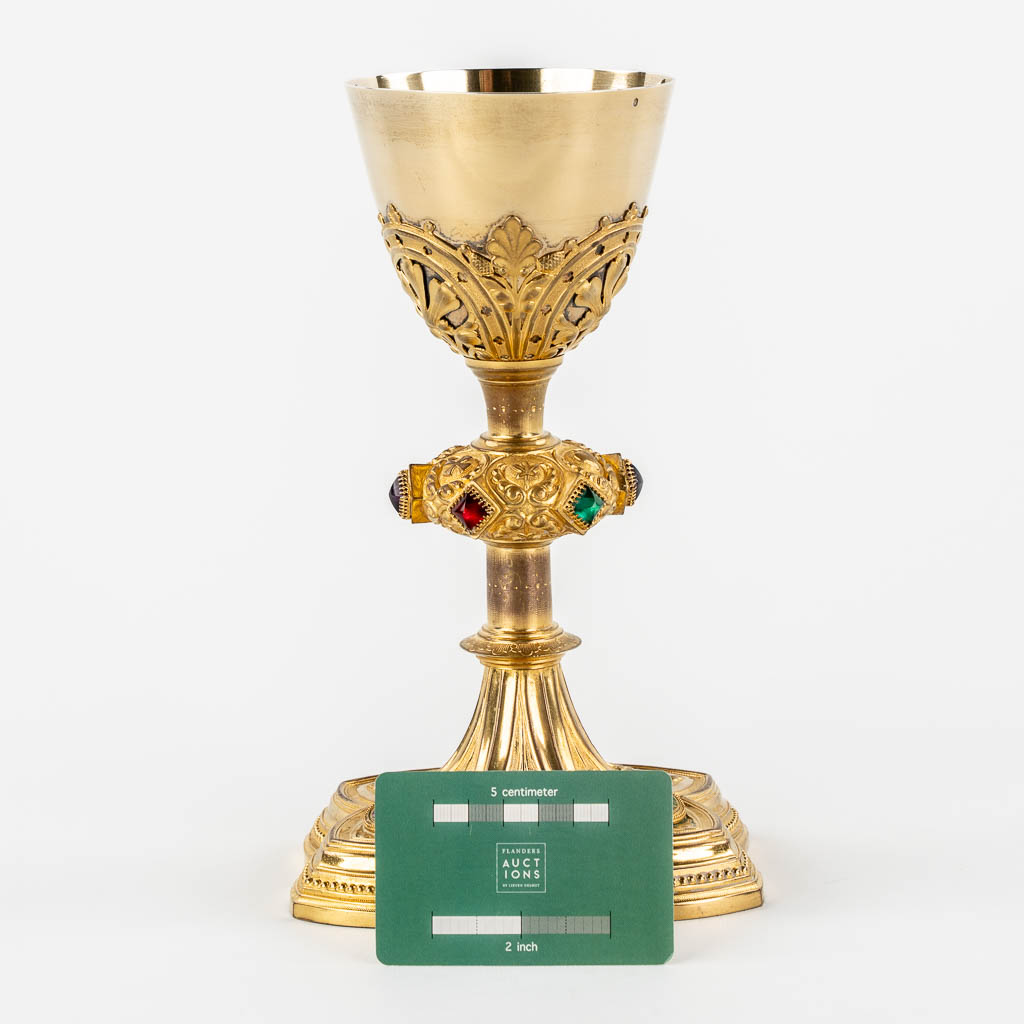 A Gothic Revival chalice with enamel plaques, cabochons. Silver Cuppa, Gilt brass, 19th C.