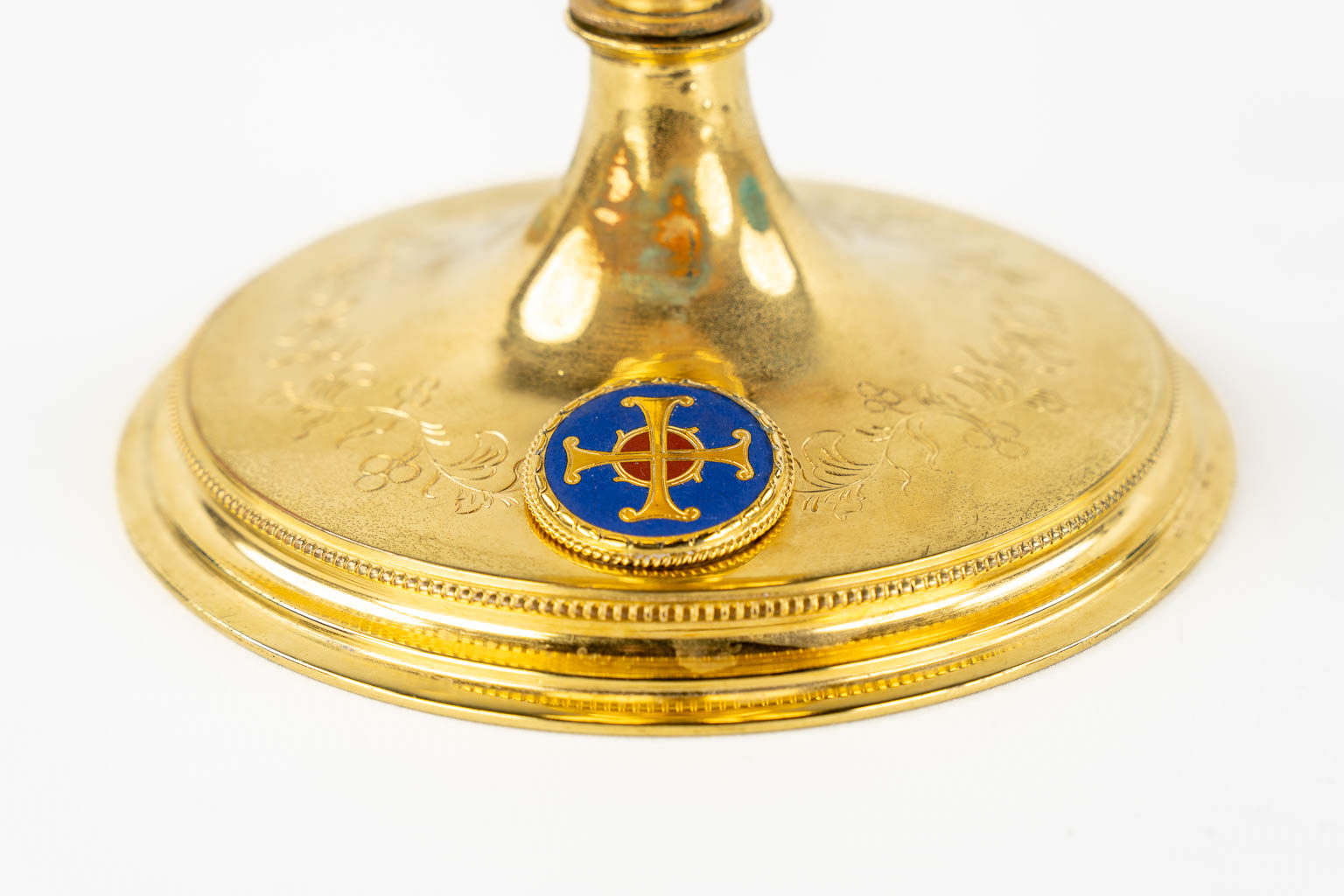 A Gothic Revival Chalice, gold-plated brass with an enamel plaque. 19th C.