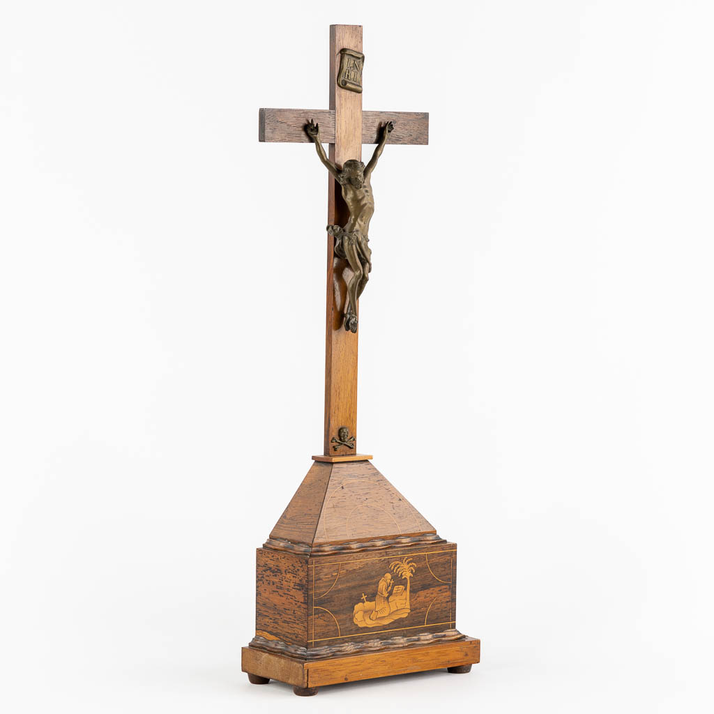 A bronze Corpus Christi mounted on a mahogany and marquetry inlay crucifix.