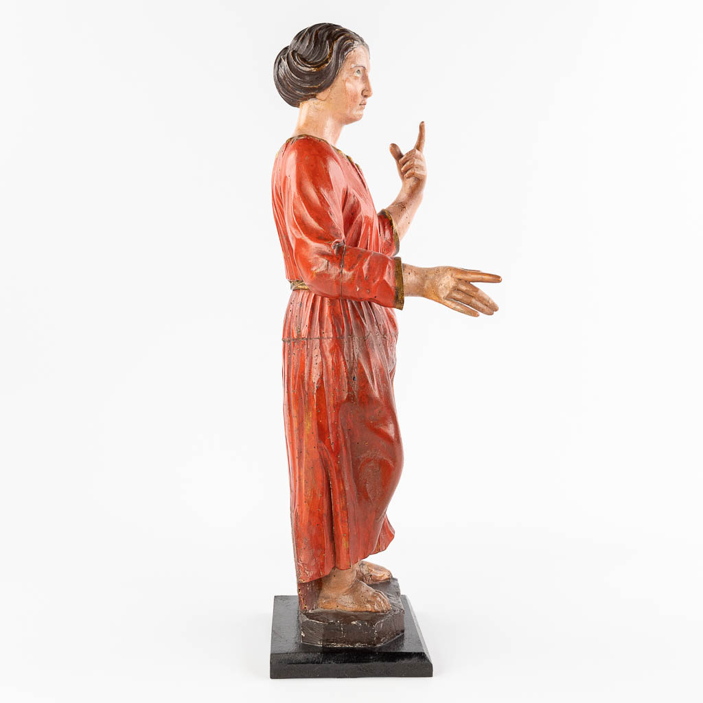 An antique wood-sculptured and polychrome figurine of a noble lady. 18th/19th C. (L: 20 x W: 25 x H: 60 cm)