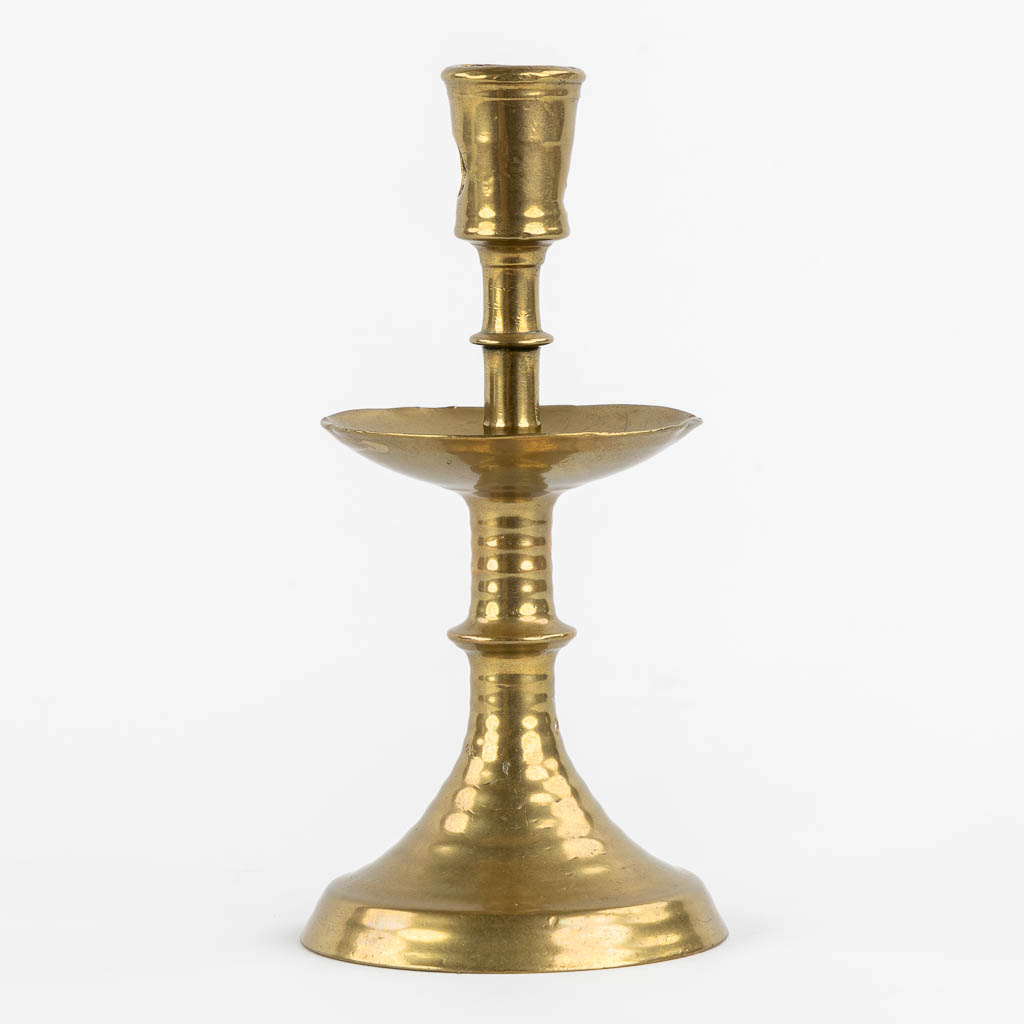 A brass disk candlestick, so-called 