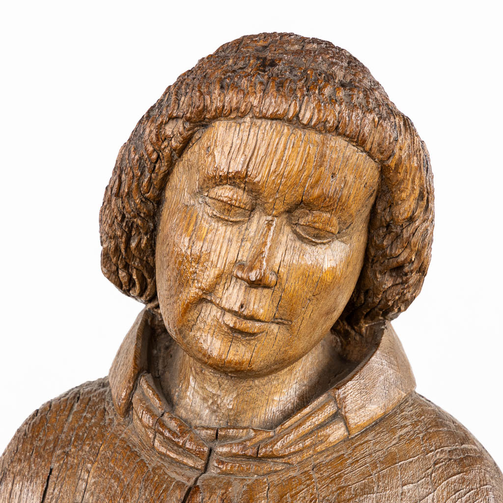 An antique, wood-sculptured figurine of Dacon Laurentius, Gothic, circa 1400. (L:22 x W:36 x H:117 cm)