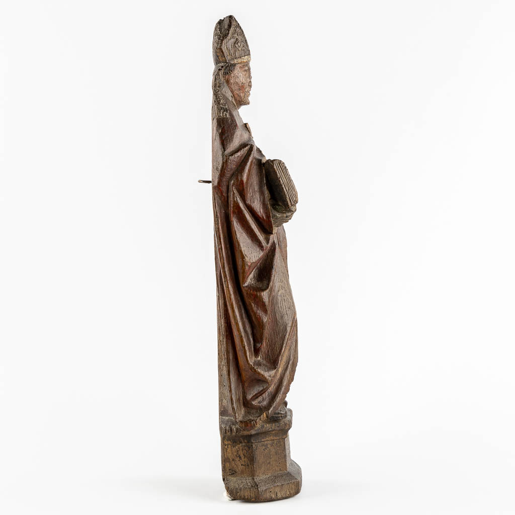 An antique wood-sculptured figurine of Saint Hubert of Liège, 17th/18th C.