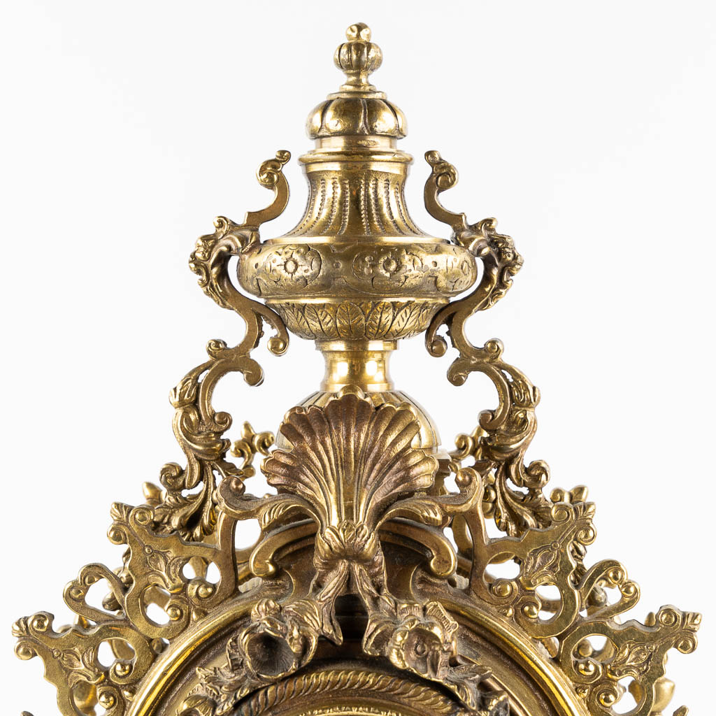 A large three-piece mantle garniture clock, polished bronze. Circa 1970.