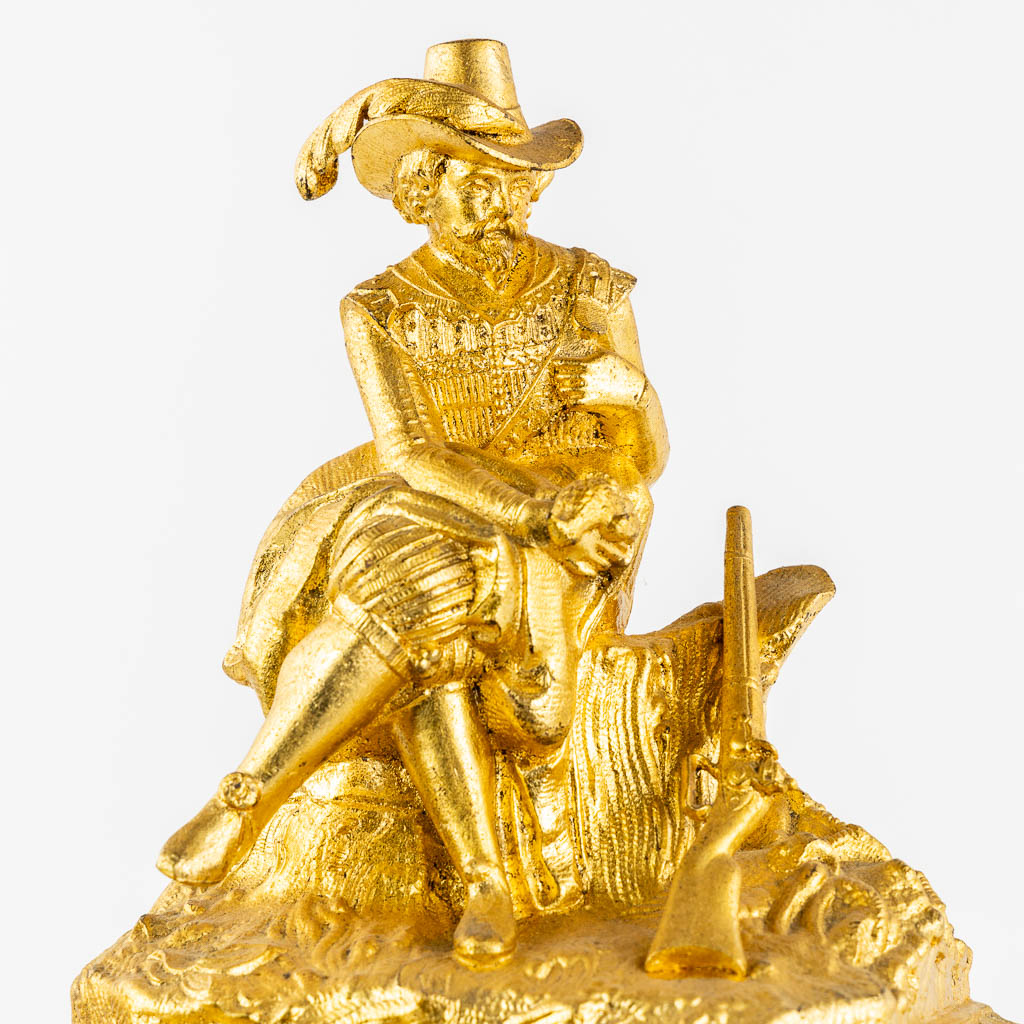 A mantle clock with a 'Hunter', gilt spelter mounted on ebonised wood. 19th C.