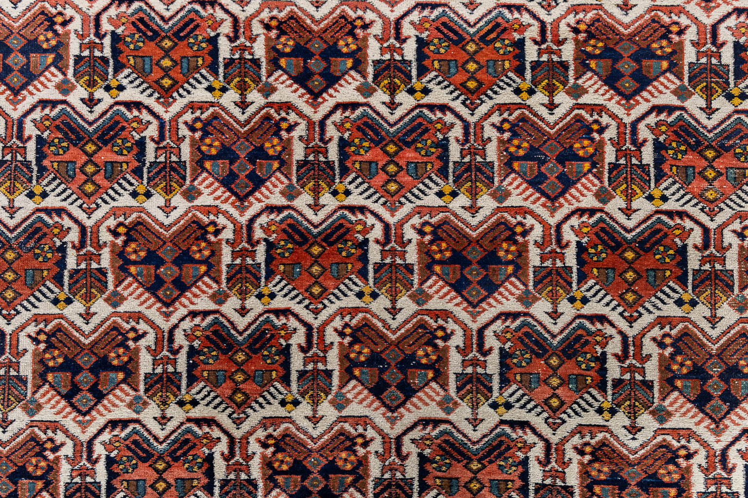 A Geometric Oriental hand-made carpet. (L:192 x W:157 cm)